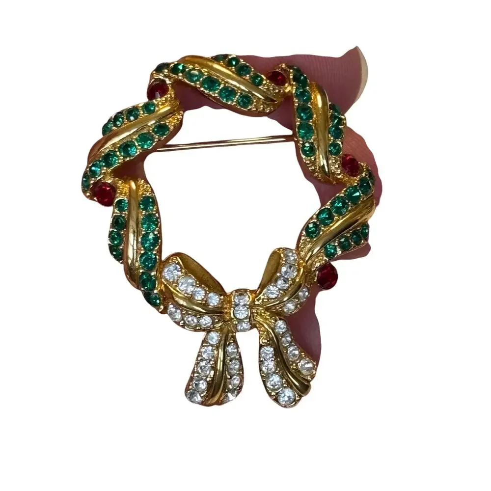 Vintage Monet Christmas brooch gold with green red white rhinestones wreath pin